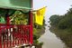 Thailand: A small restaurant flies the royal flag at the junction of the narrow Chom River and the Mekong River, Pak Chom, Loei Province