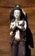 Thailand: Wooden carving of a woman clasping her hands in a 'wai' (Thai greeting) outside a guest house on Chai Kong Road, Chiang Khan, Loei Province