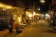Thailand: Street musician entertaining late evening shoppers on Chai Kong Road, Chiang Khan, Loei Province